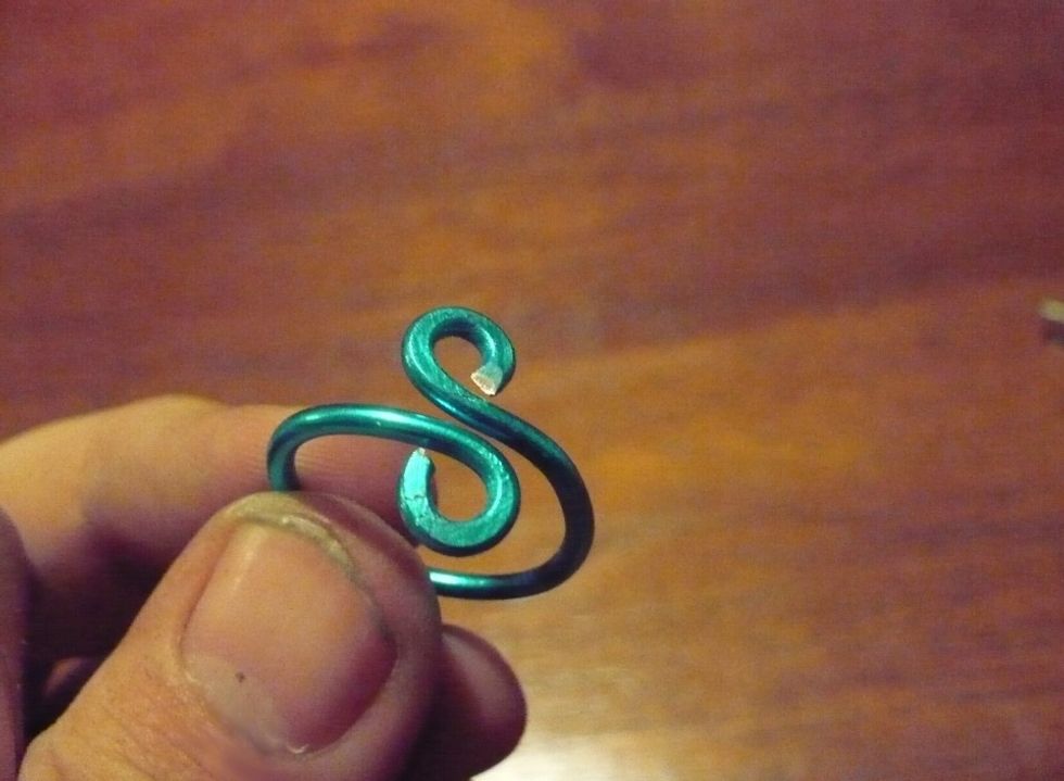 If you want a bit of an extra design element, use your chain nose pliers to flatten the edges of the loops. If you used hard wire, prepare to break a sweat. \ud83d\ude1c