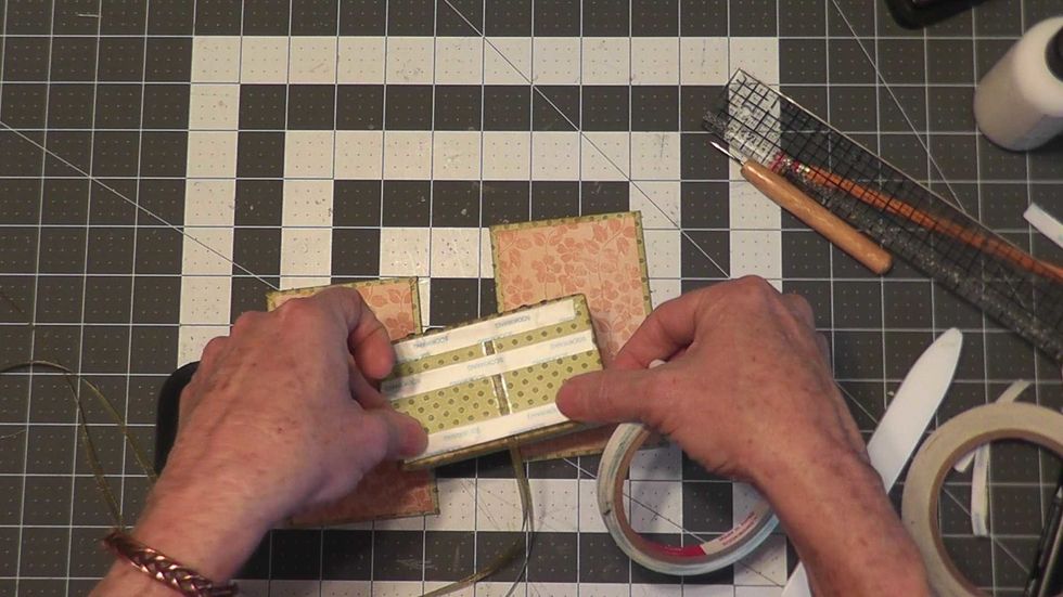 If you want a ribbon tie closure, attach your ribbon now.  If you plan to use a magnetic closure you can add it later.  Apply Scor-Tape to each large side of the boxes on the outside.