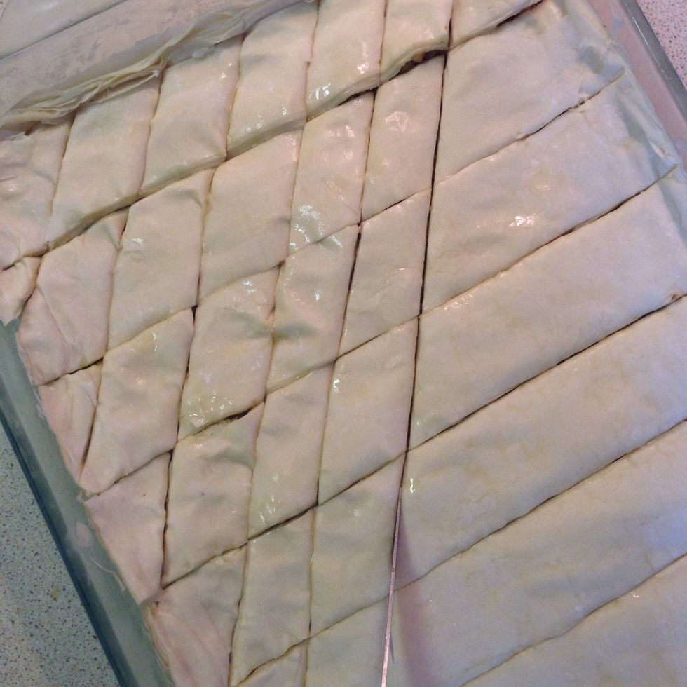 If you want diamond-shaped baklava, cut diagonal lines, starting from one corner of the baking tray to the other. (You may want to visualize this step before you start the cutting.)