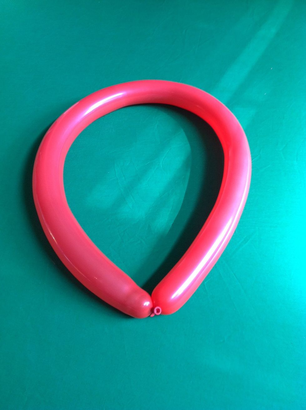 If you want  make a heart balloon, tie the balloon in a circle