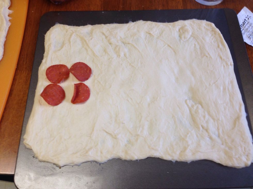 If you want pepperonis add them to the bottom before you add spaghetti to the center "lane". Make sure to leave about 4-5 inches on both sides of the flattened bread for the braid.