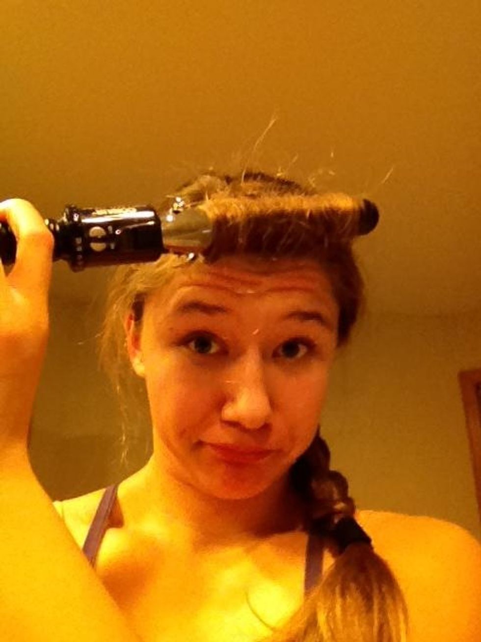 If you want the best effect for your "Elsa" bangs, curl your bangs (or if you don't have bangs, any hair that was missed by the braid).