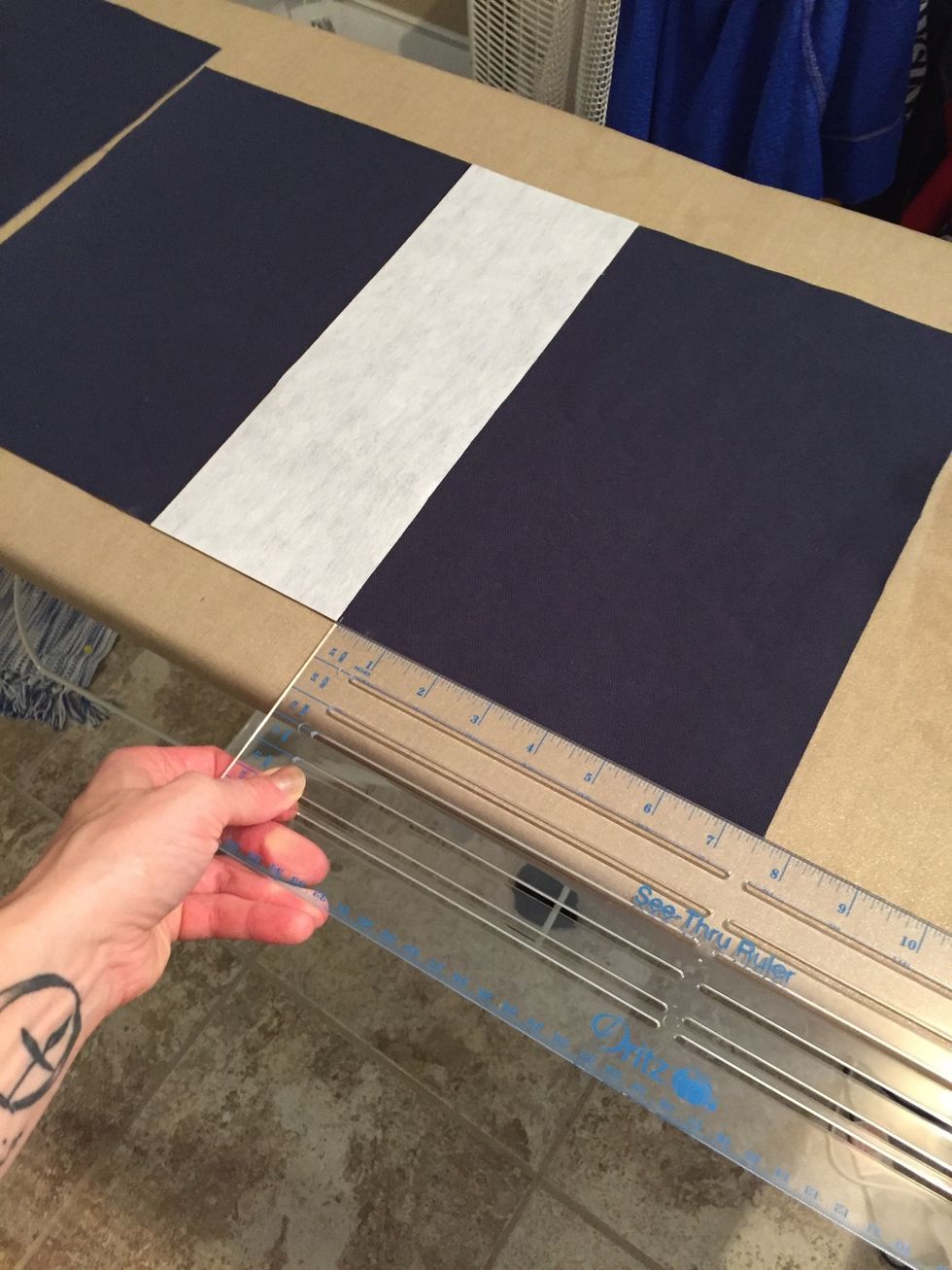 If you want to add interfacing to stabilize the handle, cut two 11x4" rectangles of interfacing and fuse it in the center of the body fabric. The interfacing should be centered at 7.5" from corners.