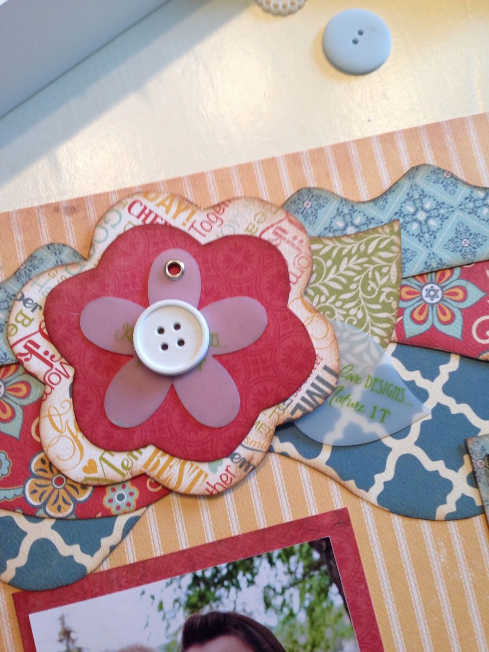 If you want to add more layers using your scraps....just add a couple of accessories to your design where you feel it is needed.