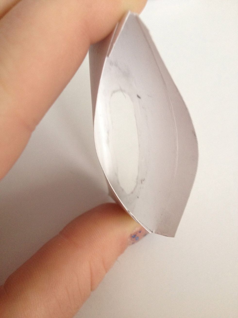 If you want to make it look like a bill, cut a hole and a small piece of tracing paper. Glue the tracing paper on the inside of the envelope. (Or use the clear material from an actual bill (: )