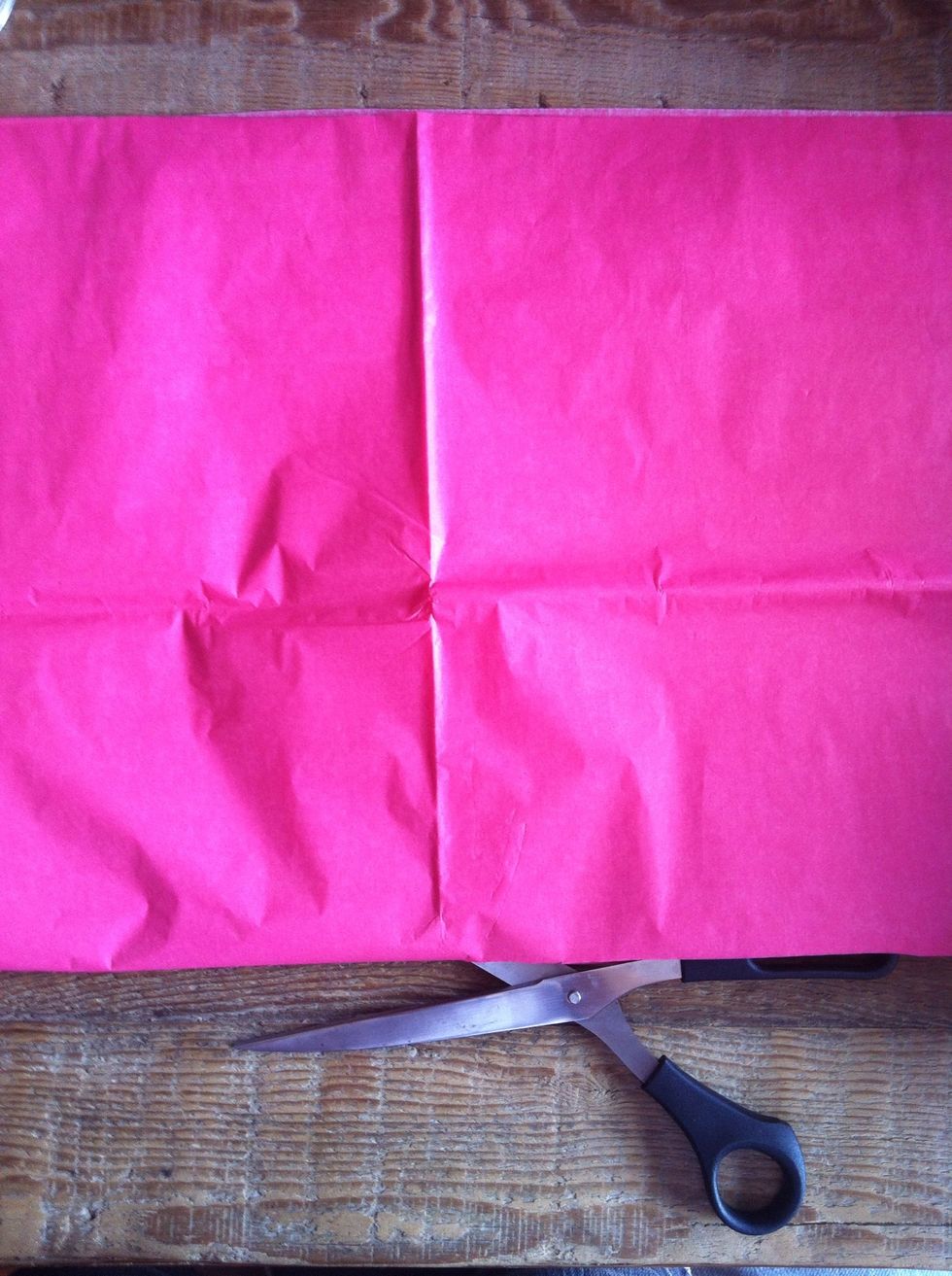 If you want to make smaller size pom poms cut the stack of tissue paper in half. If not, proceed on.