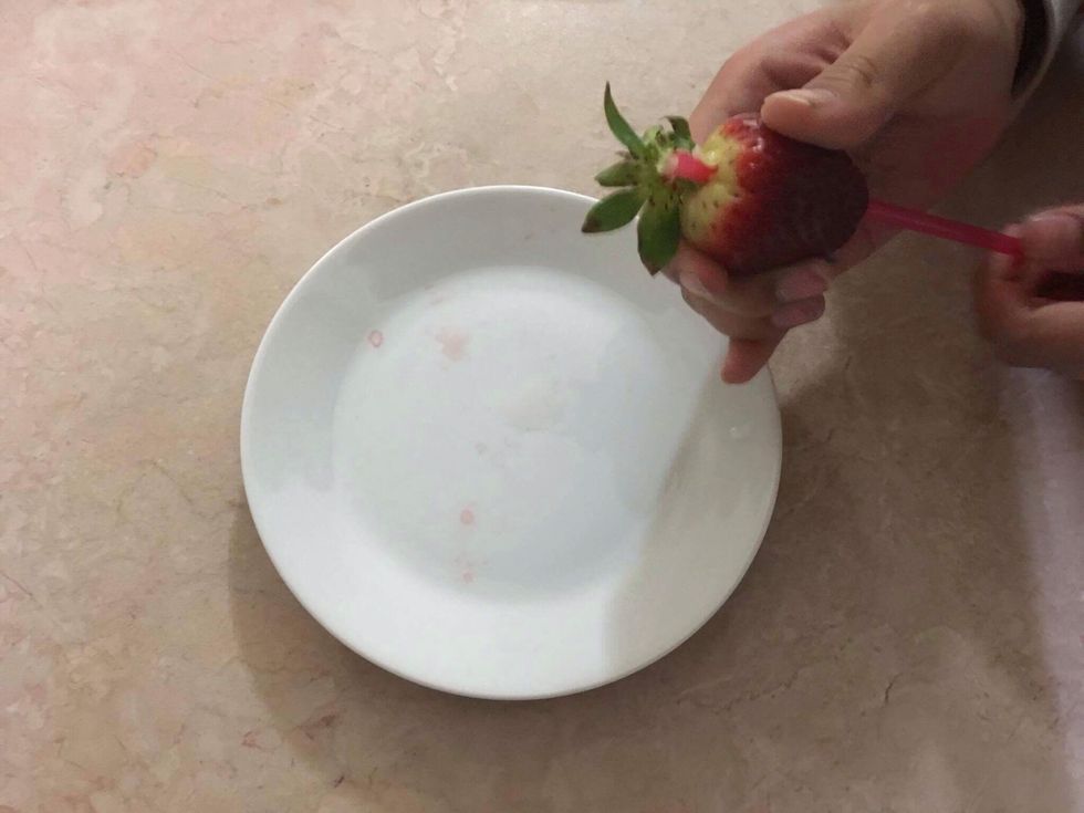 If you want to take out the leaves in the strawberry easier, then use a straight straw! Place the edge of the straw in the bottom middle part of the strawberry, then push it up, and it will come off!