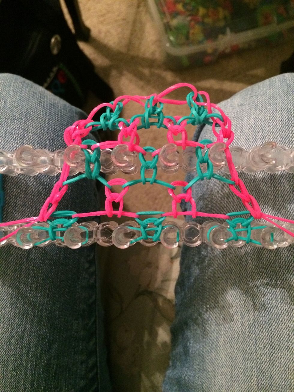 If you want to you can take out the center row of pegs cause we aren't really using it. Keep adding rows of three colors each until you have the desired length that you need.