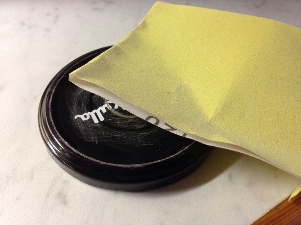 If you want to you can use sandpaper to make the surface of the lid less "slippery".