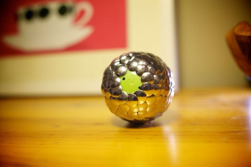 If you want your egg to stand up on it's own, leave a dime-sized area at the bottom without any glue or tacks. This will keep the bottom flat and your egg sturdy!