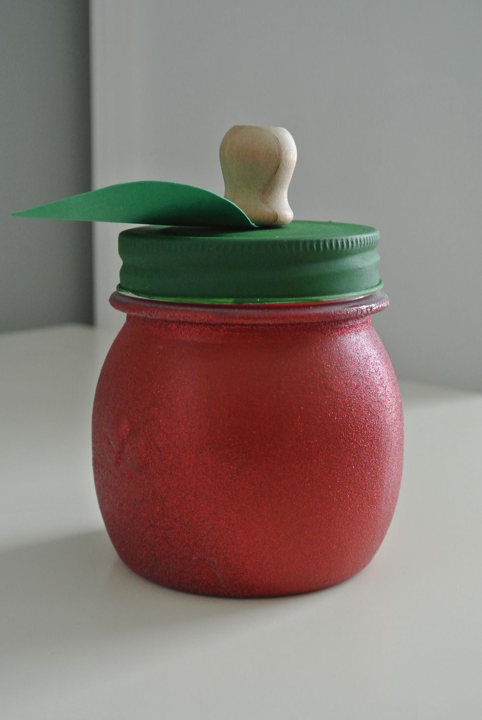 If you would like to make your jar sparkly remove lid from jar and turn jar upside down where the opening is facing the ground. Use your Krylon glitter spray to cover jar. Allow 10-15 min for drying