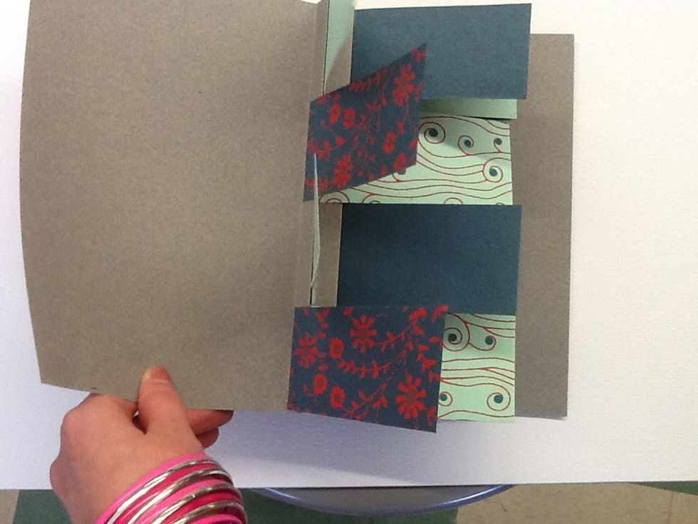 If your book cover is too wide, you can trim it now using the width of the flags as a guide.