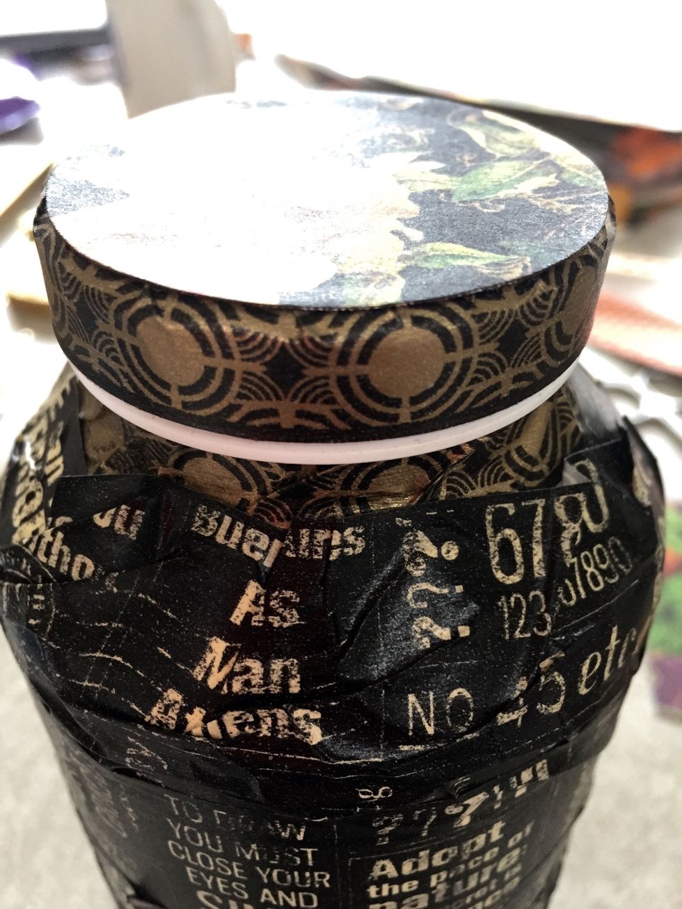 If your bottle has any white space left like mine, place some gold Stickles on it, then sprinkle gold glitter over it.