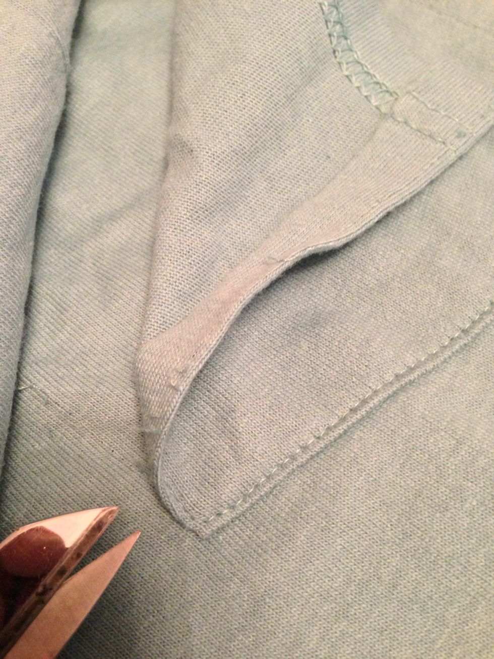 If your larger T-shirt has a pocket, carefully remove the pocket where it might be cut off by the curve.