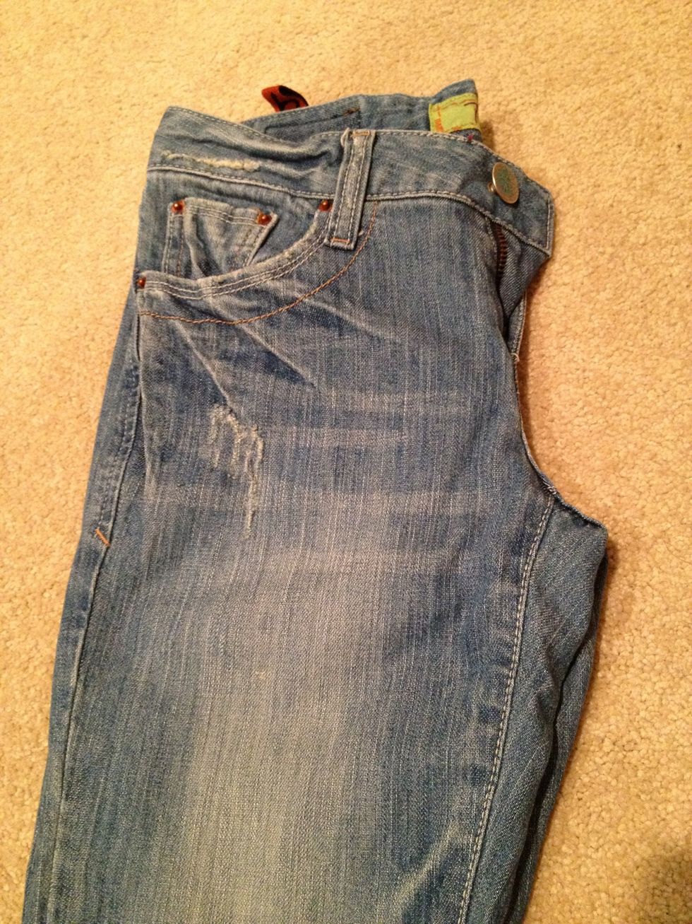 If your pants aren't flat enough, fold them in half and try cutting them.