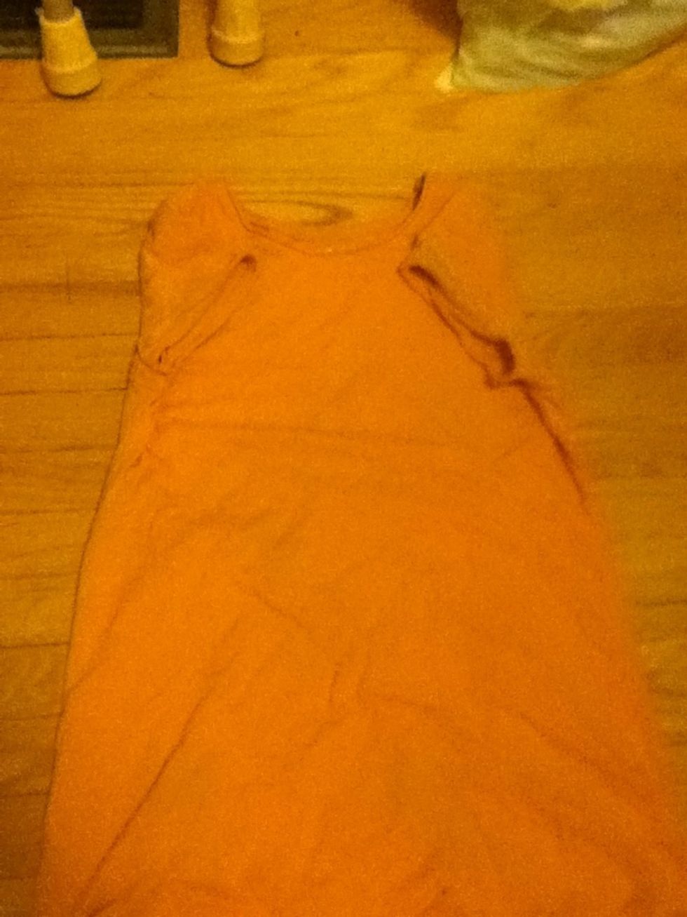 If your shirt has arms holes (lol don't know what there called) fold them inwards. If not then skip this step.