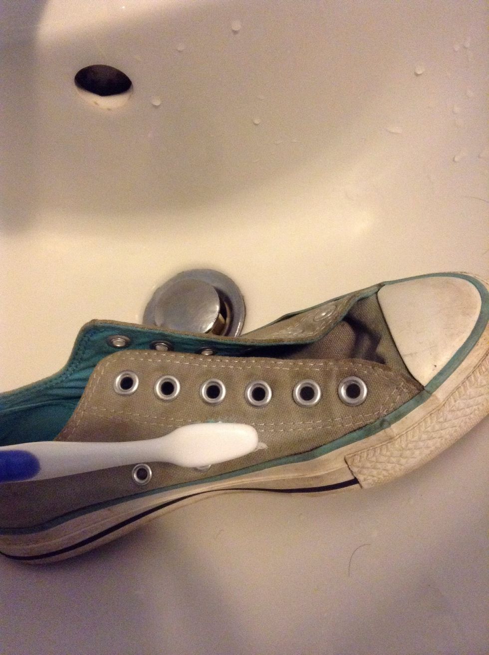 If your shoes are dirty like mine. clean them by scrubbing them with an old toothbrush and some lukewarm soapy water
