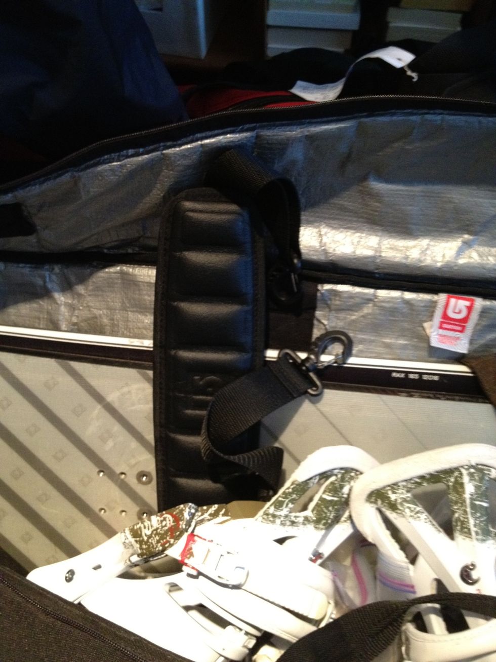 If your snowboard bag has a removable strap, remove it and place inside. Basically you should prepare for the worst to happen to your bag - baggage handlers may toss it around like a ragdoll.