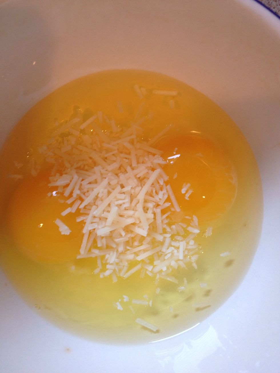 Im a separate bowl, add in your eggs and the Parmesan cheese