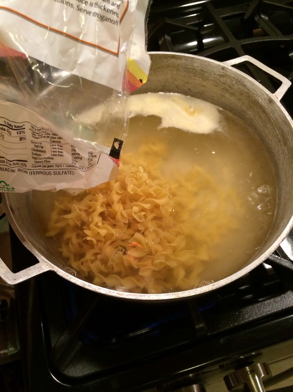 Immediately after add your noodles. Cook them according to the package instructions.