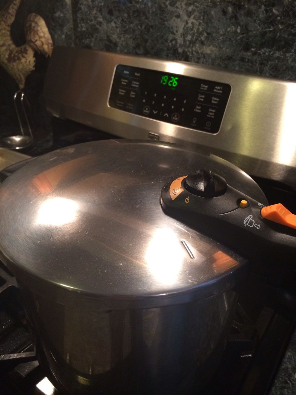 Immediately lock the pressure cooker and cook the ribs over medium high heat until the high pressure is reached. Reduce the cooker to med low and cook in high for 20 minutes.