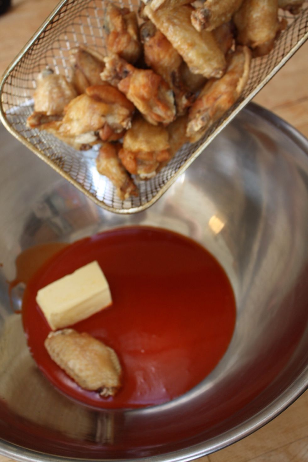 Immediately pour out the hot chicken into the sauce and butter.