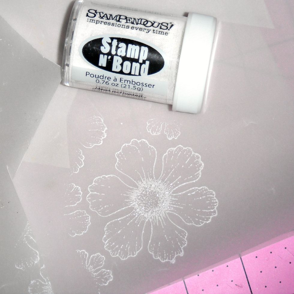 Immediately pour Stamp 'n Bond adhesive powder and shake excess off. Use the heat gun to melt the adhesive powder.