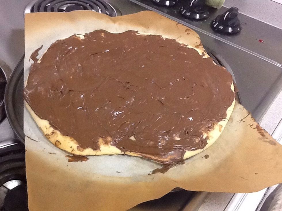 Immediately spread the Nutella on to the pizza :<