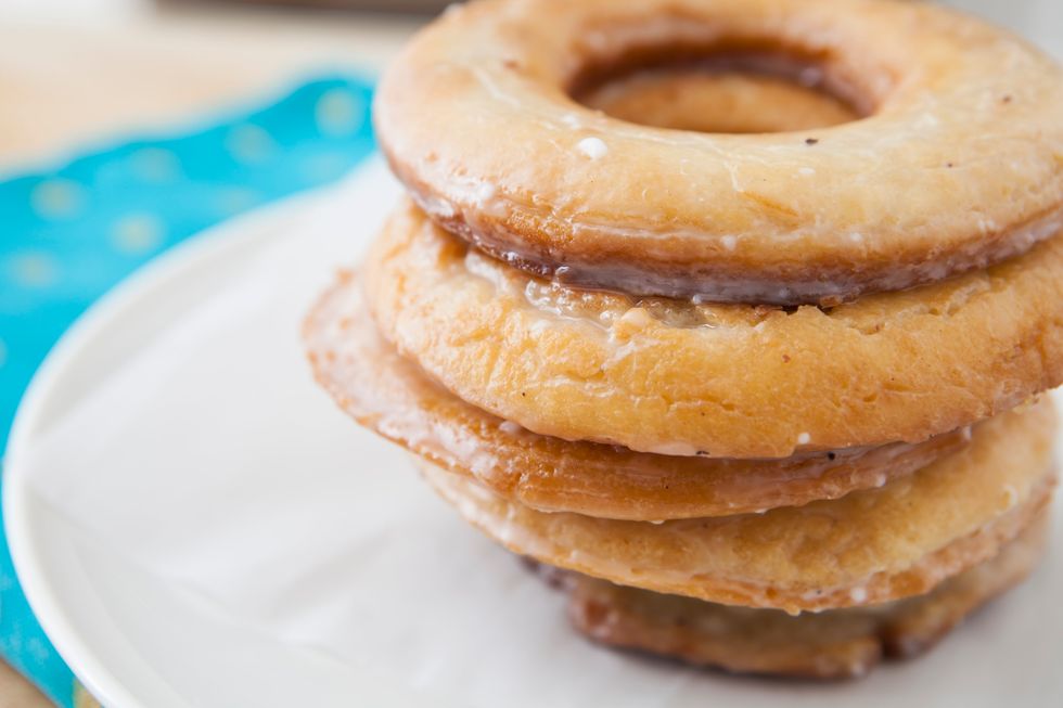 Immerse each doughnut into the glaze. Place back on the wire rack. Have the wire rack on top of a sheet pan to catch any extra glaze. Let sit for 20 minutes, or until glaze is set. Enjoy!