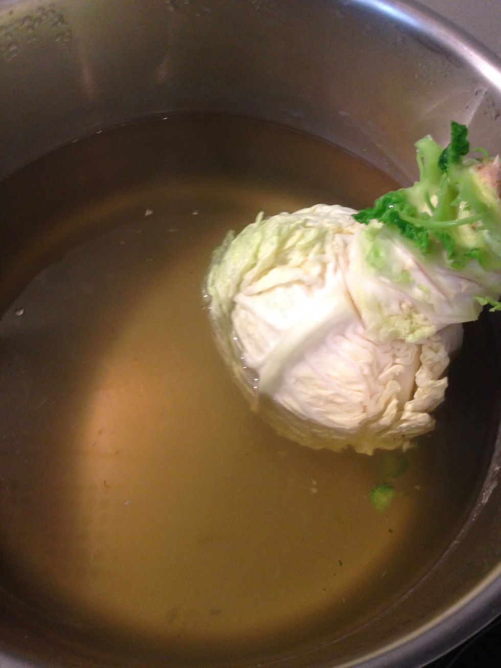 Immerse the cabbage in boiling water and