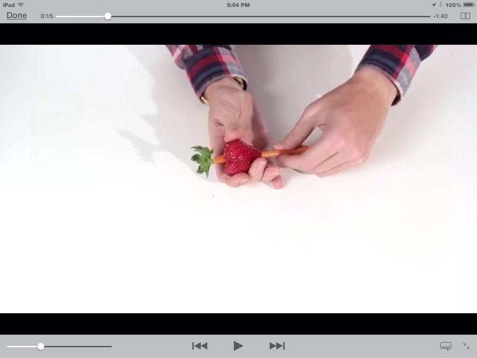Impale the straw into the strawberry, and it will take the leaf off of the strawberry