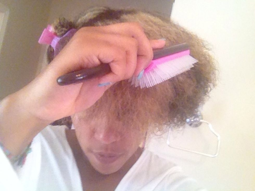 IMPORTANT: Detangle your hair using a tool of your choice. I like to use a Denman brush. The less tangles the easier to manage, braid, and style. This step will result in a more polished look.