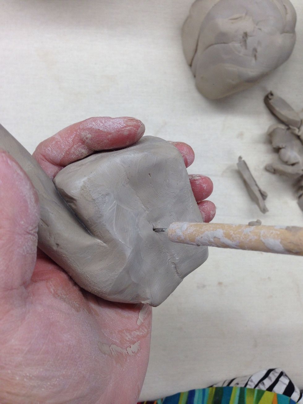 IMPORTANT:  Poke a hole some where, (not to noticeable) to allow air to escape from the hollow area in the body.  If you do not do this, your piece will explode in the kiln.
