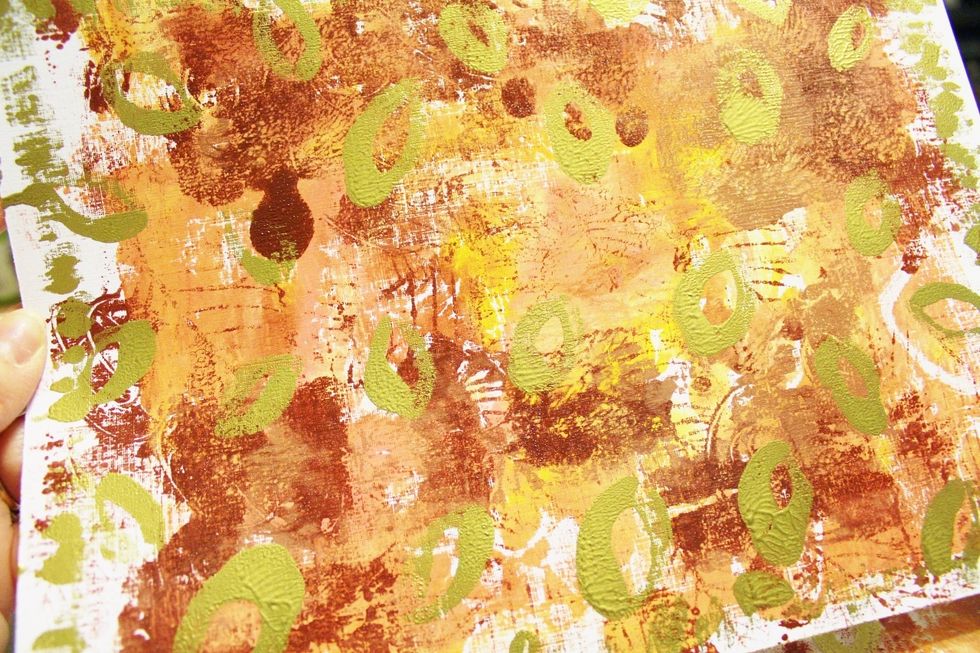 impress paper again to add third and final layer to paper; heat set...