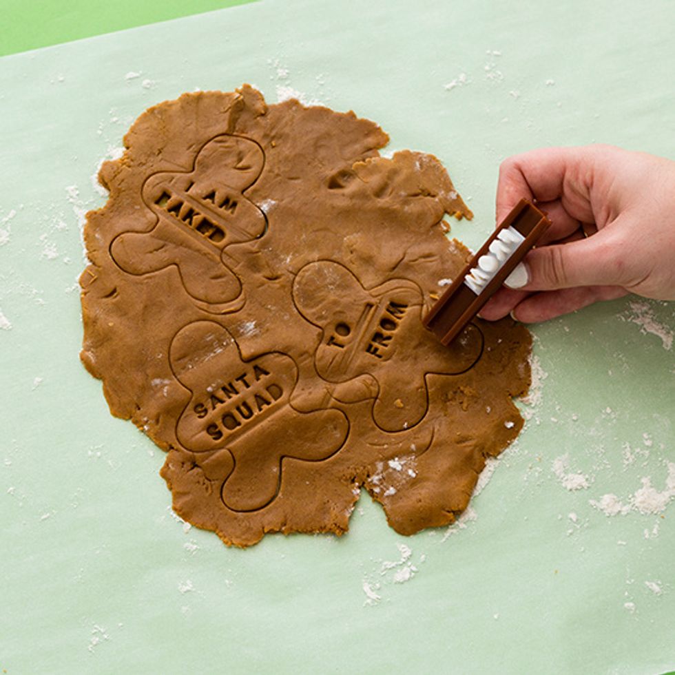 Imprint your words of choice. Use a straw to punch a small hole at the top -- this is how you'll string these tasty tags onto your gifts!