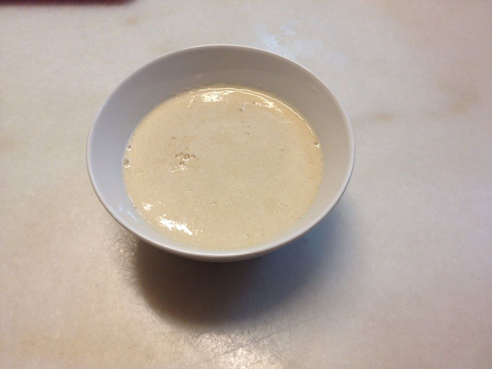 In 1/2 cup of the warm water, pour in sugar & yeast. Do not stir & let it sit for 5 minutes. Stir the mixture until it all dissolves in the water.