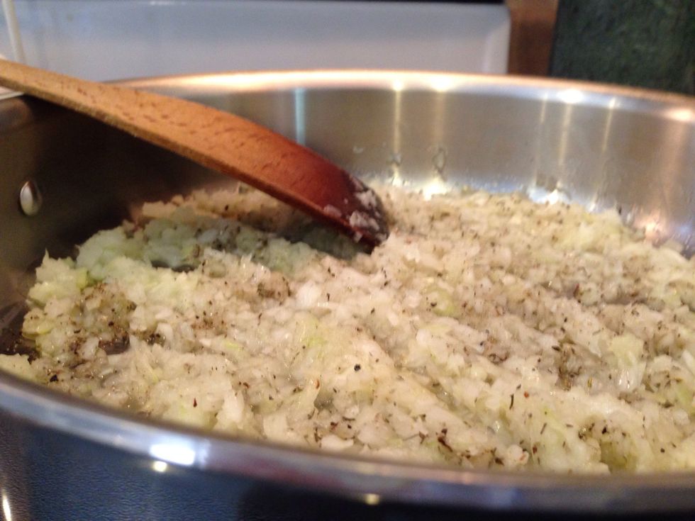 In a 12 inch saut\u00e9 pan, heat olive oil over medium-low heat and add the onion, thyme, salt and pepper. Cook for 8-10 minutes until onions are translucent but not brown. Preheat oven to 350 degrees.