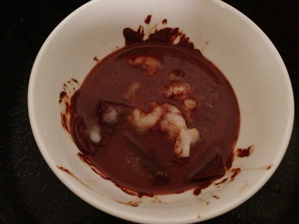In a 4 cup measuring cup or medium microwave-safe bowl, melt chocolate and coconut oil in the microwave on low power.  Stir until smooth and let cool. These were still melting up! Smells amazing! \ud83c\udf6b