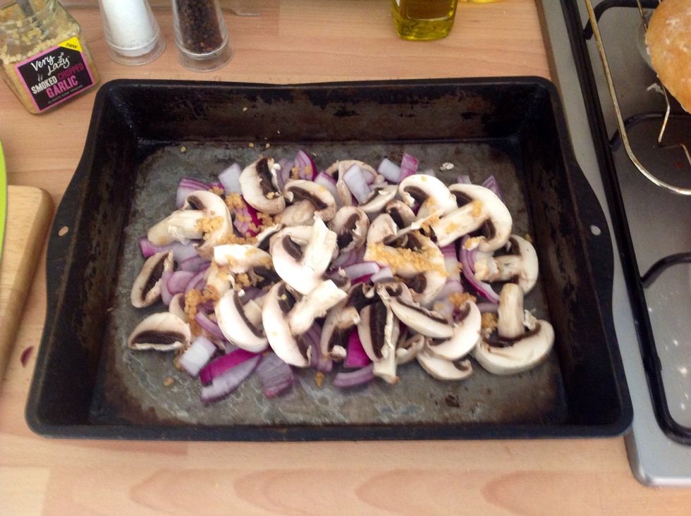 In a baking pan big enough to fit your pork make a bed out of the chopped mushrooms, red onion and garlic
