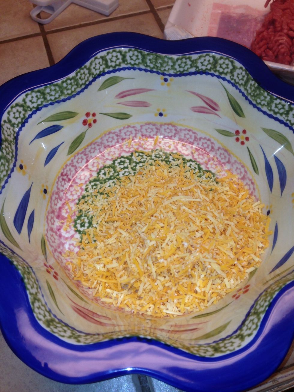 In a big bowl add your cheese of choice. I use Mexican shredded cheese. Or you can use nacho cheese too. Those taste the best with this dish.