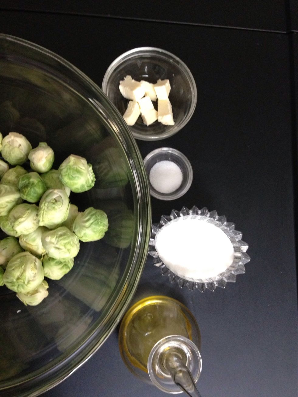 In a big bowl, put 1 kg Brussels sprouts + 2TBsp olive oil + 1 tsp of salt+1tsp of sugar+ 20  gm butter. Mix.