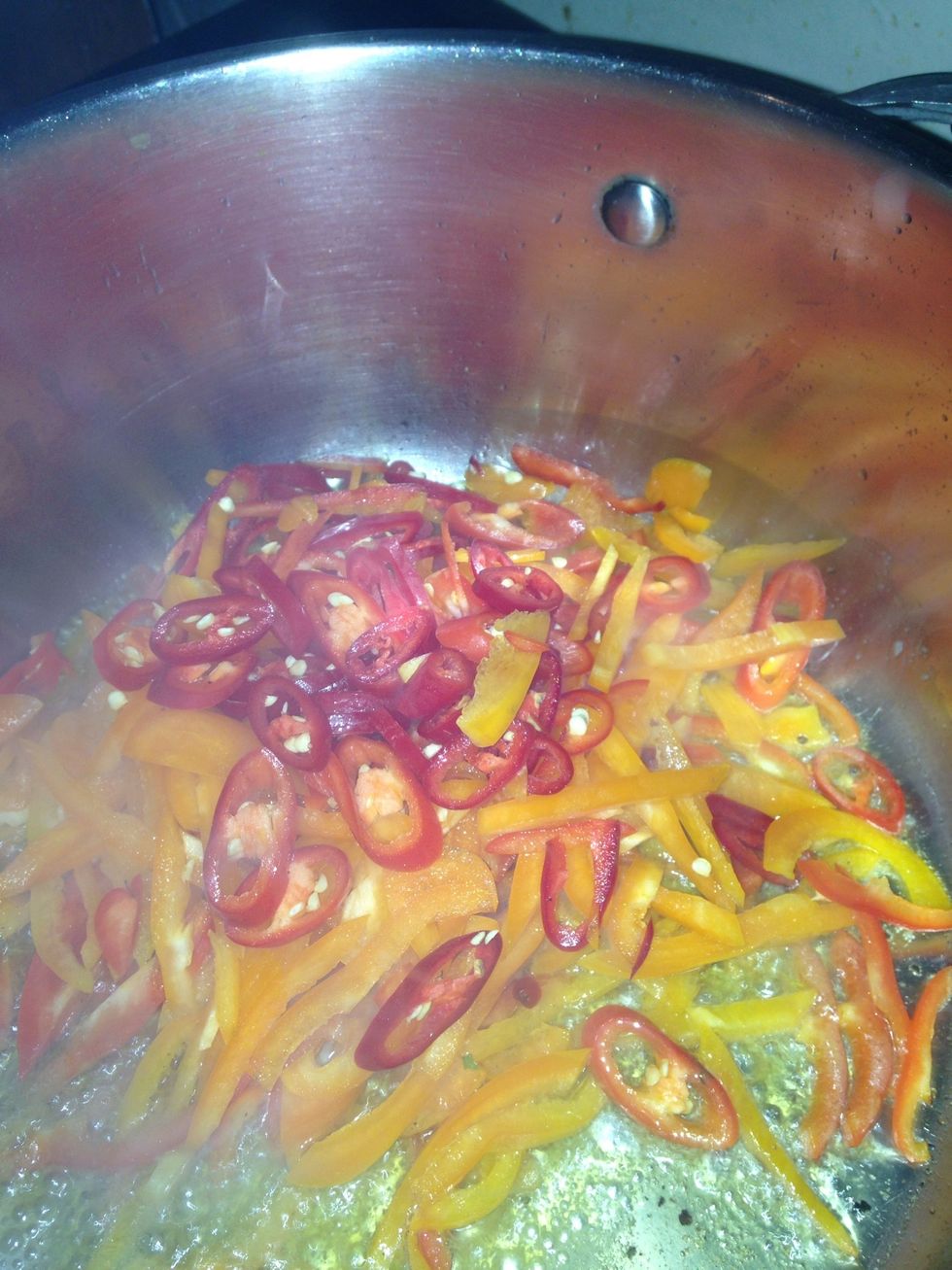 In a big pot, hear some oil and add the peppers, chilli, and salt and pepper. Stir fry til softened. Add the bacon and stir fry for 5 min. Add the tinned tomatoes and paste and simmer for 10 minutes.