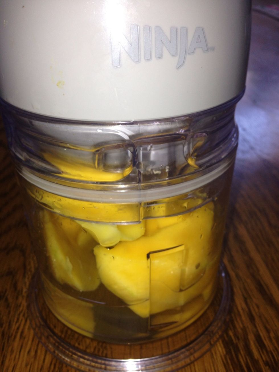 In a blender, blend 1 mango with quarter cup of water.