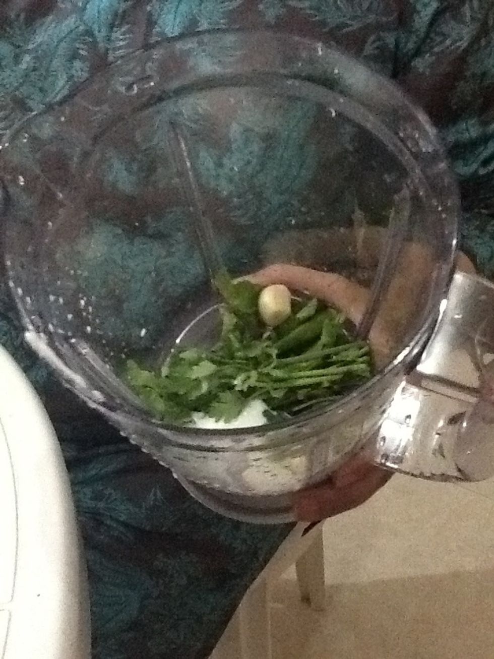 In a blender put 2 tablespoons of yoghurt, a few cumin seeds, green chillies and some mint leaves followed by half a tea spoon of salt. Blend.