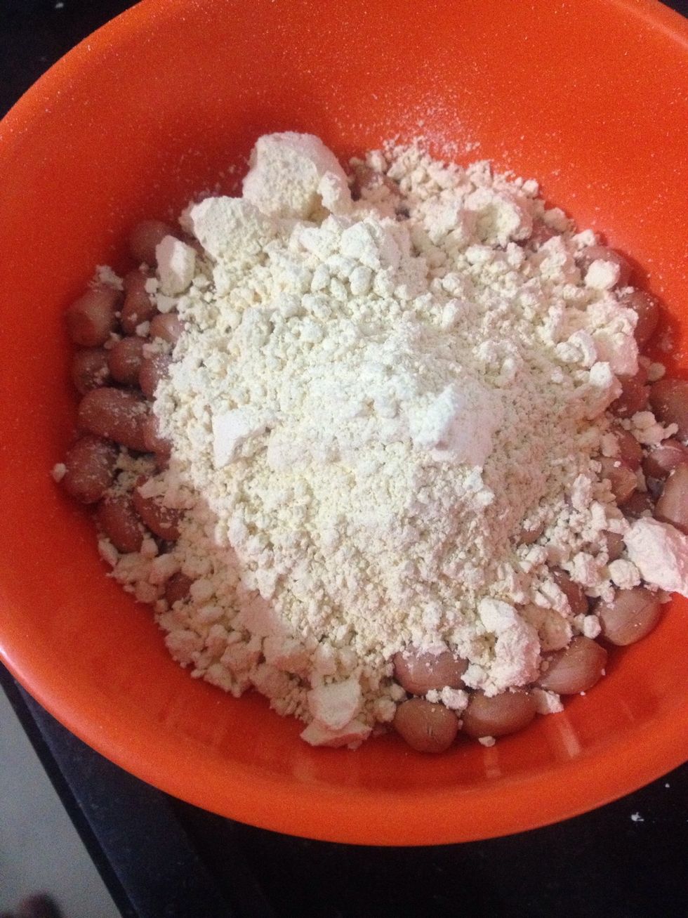 In a bowl add groundnuts , chickpea flour