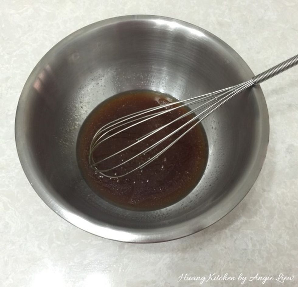 In a bowl, add in golden syrup, peanut oil followed by alkaline water. Whisk everything together until well blended.