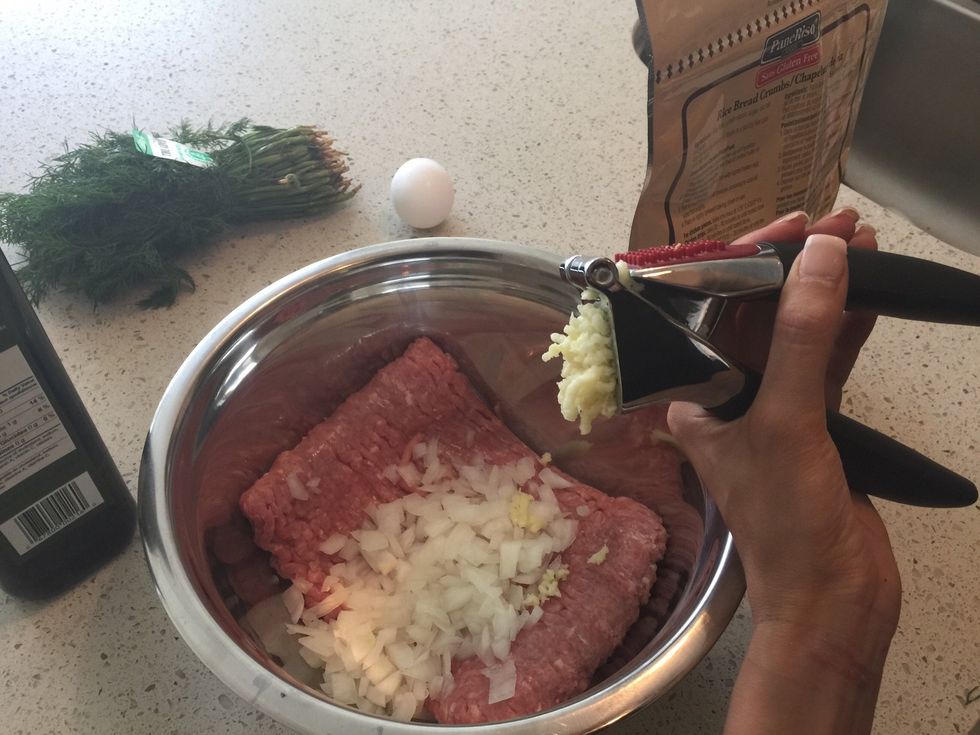 In a bowl, add the ground turkey, chopped onion and crushed or chopped garlic