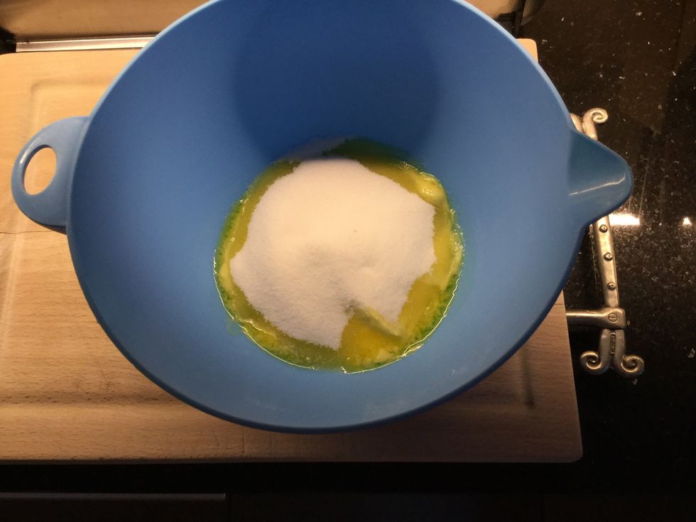 In a bowl combine sugar and softened butter