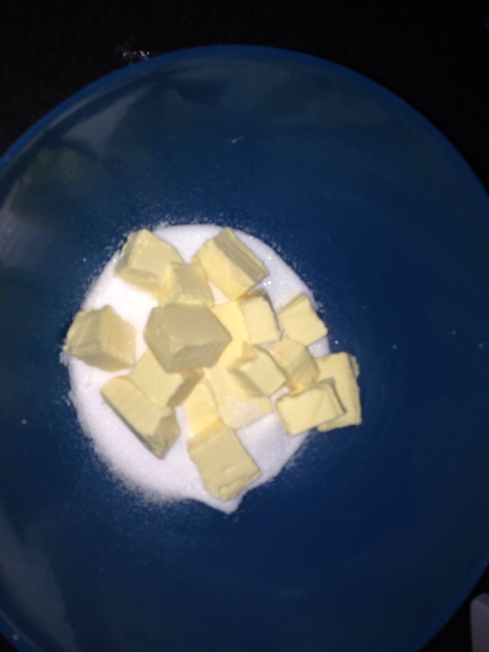 In a bowl cream together the butter and sugar until soft