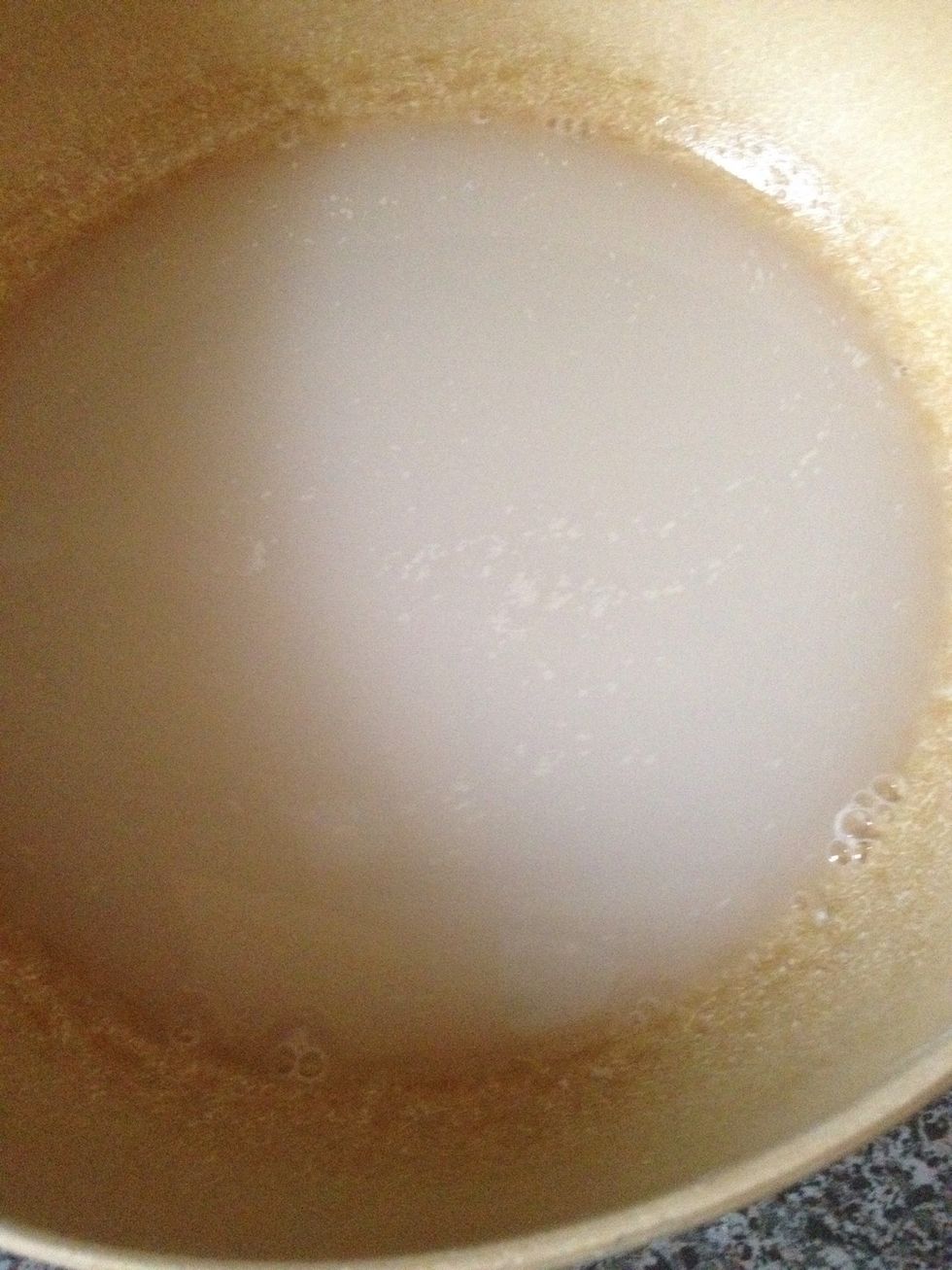 In a bowl get 1 cup Luke warm water then add yeast 1 tsp or 1 packet am using active yeast. Then add 1/2 tsp sugar this will help to activate the yeast. Cover 10 mins